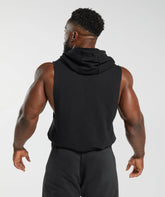 المنظر الخلفي لرجل يرتدي Gymshark أسود بلا أكمام | United We Sweat Legacy Drop Arm Hoodie تصميم عصري.